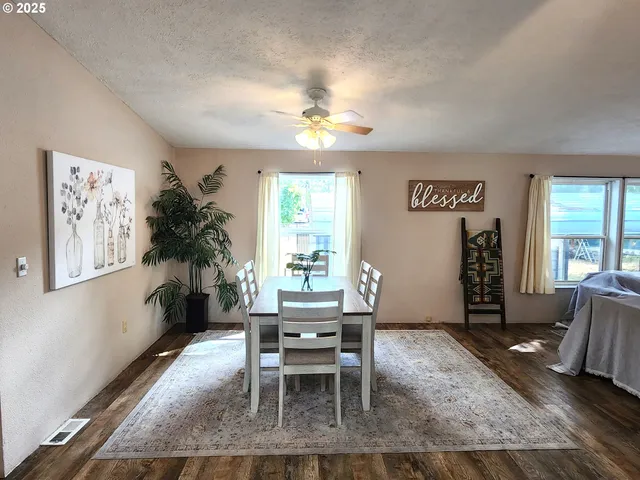 a dining room with furniture and window