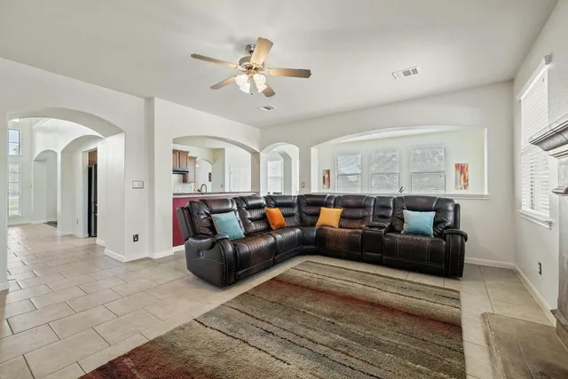 a view of a hallway with seating area