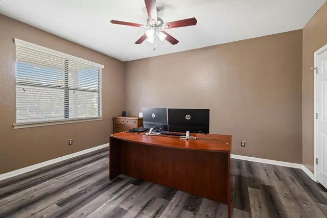 a workspace with furniture and a window