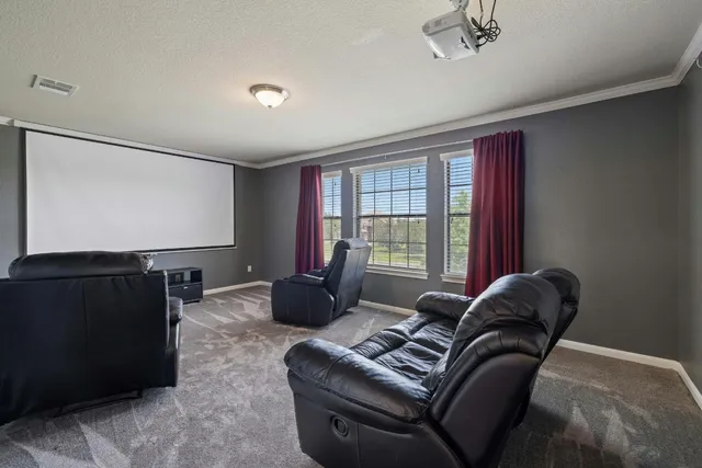 a bathroom with a sink a toilet and shower a mirror