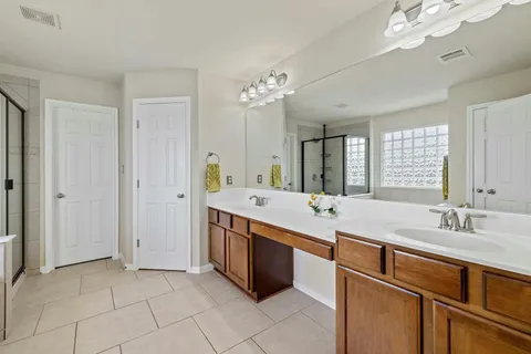 a bathroom with a sink a vanity and a mirror