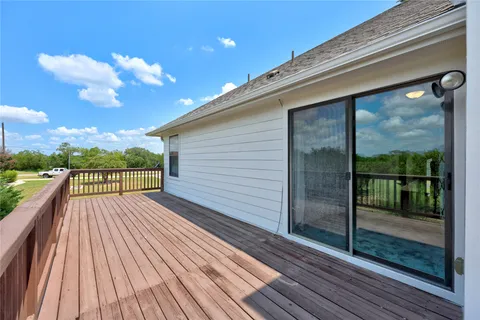 a view of a balcony with wooden floor