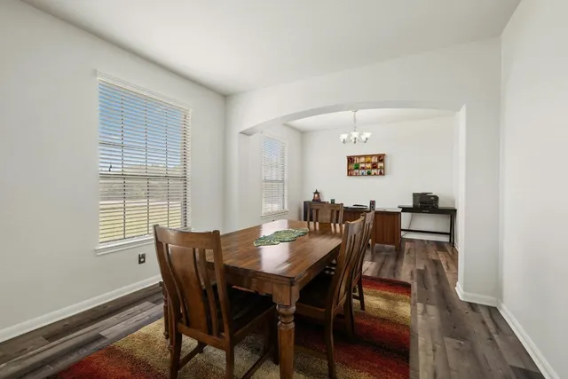 a large kitchen with stainless steel appliances cabinets a sink and a counter top space