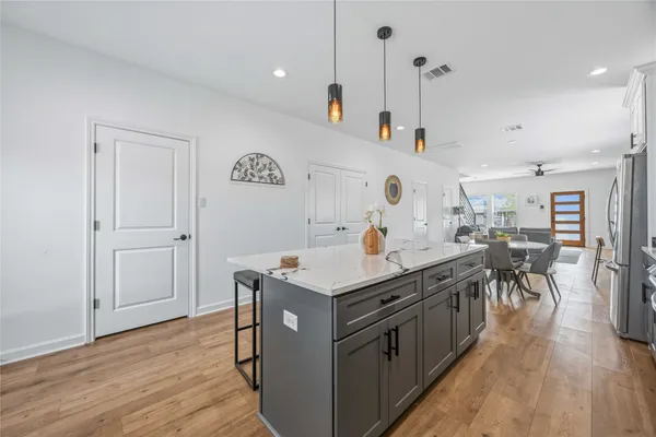 a kitchen with a stove and a table