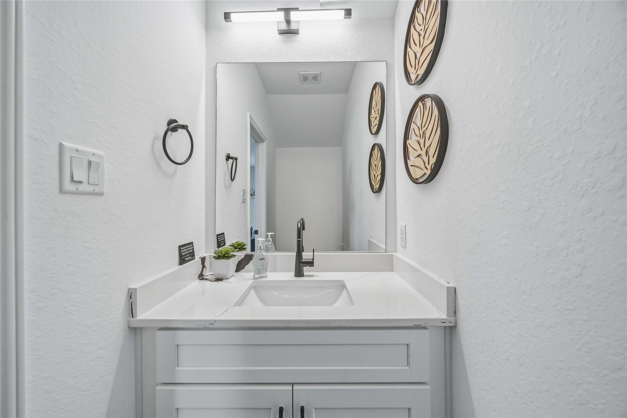 6130 Conley Street, Unit A Houston, TX 77021 - Photo 15 of 30 a bathroom with a sink and a mirror