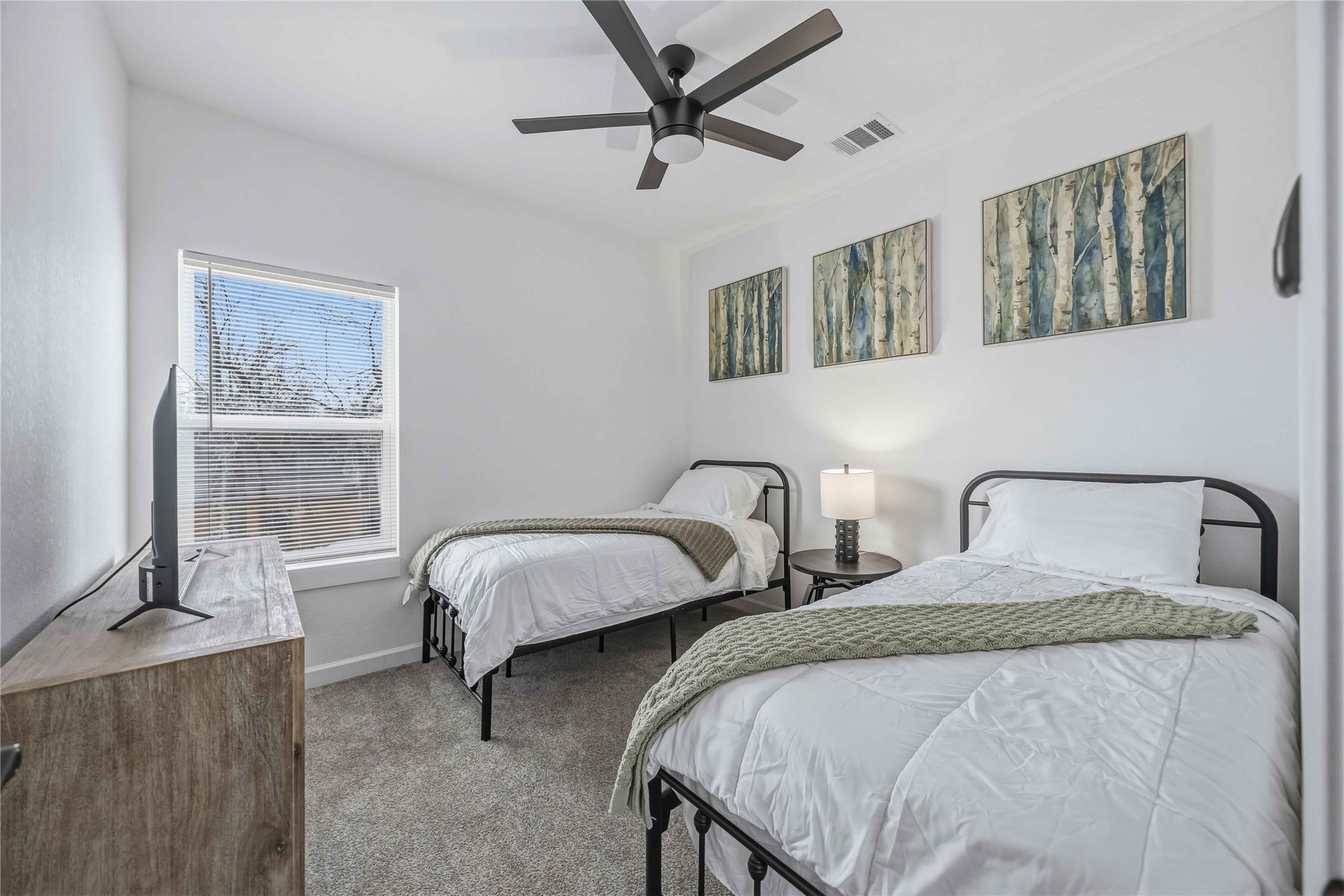 6130 Conley Street, Unit A Houston, TX 77021 - Photo 20 of 30 a bedroom with two beds and windows