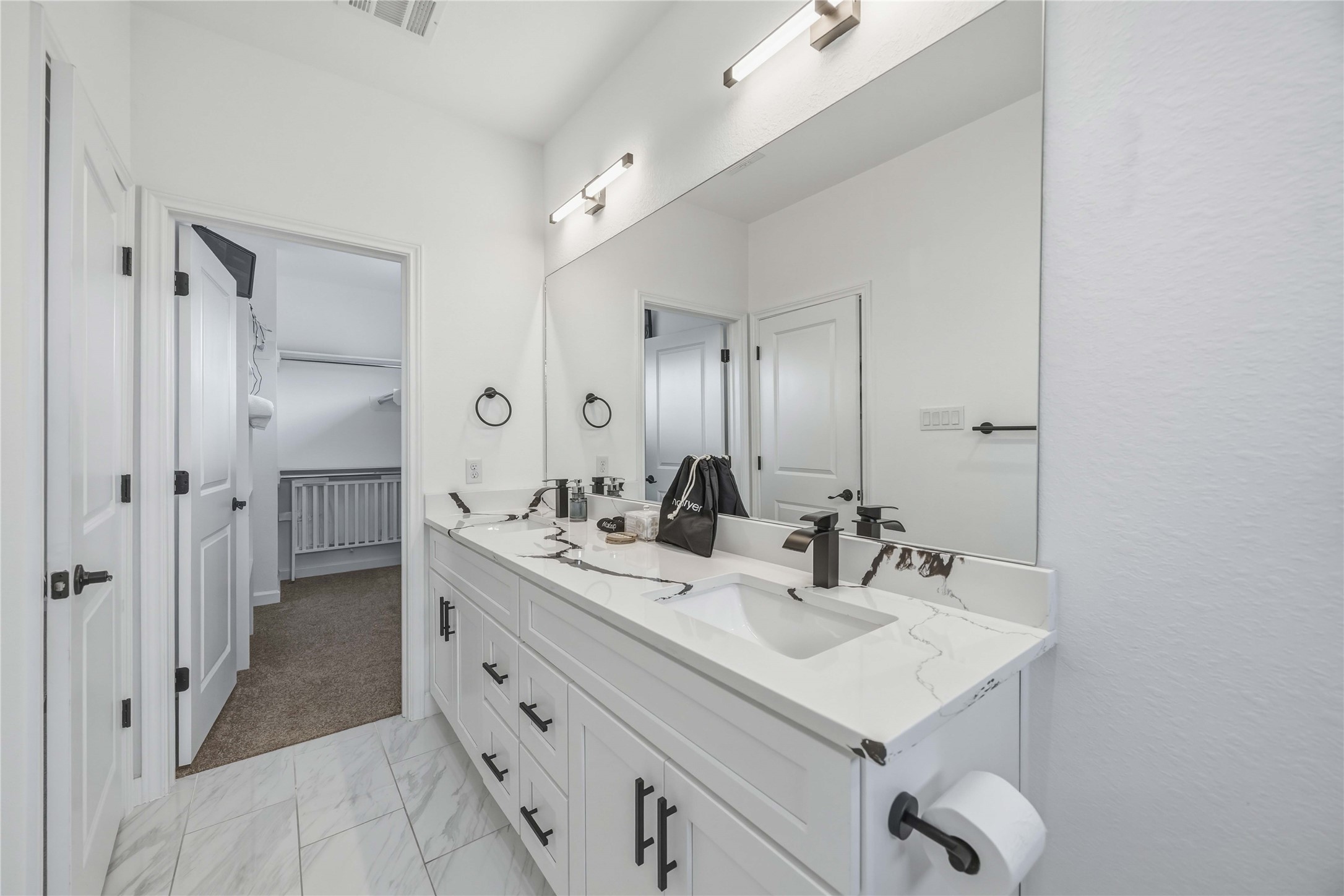 6130 Conley Street, Unit A Houston, TX 77021 - Photo 25 of 30 a bathroom with a sink double vanity and a mirror