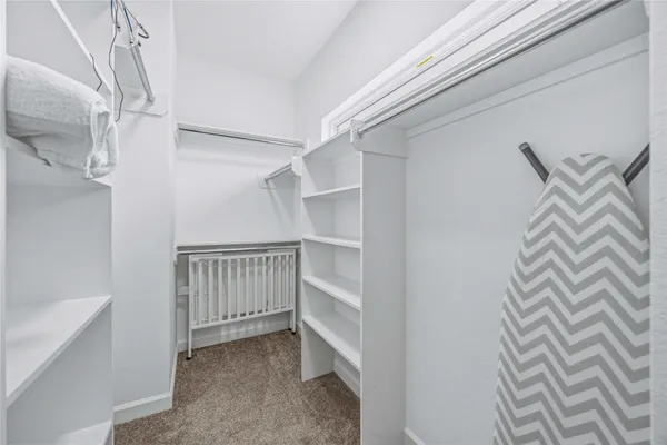 a view of an empty walk in closet