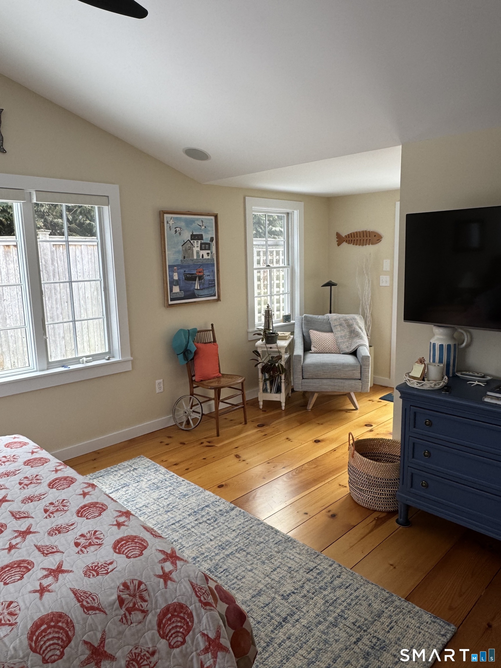 84 Waterside Lane, Unit 3 Clinton, CT 06413 - Photo 12 of 37 a bedroom with furniture and a flat screen tv
