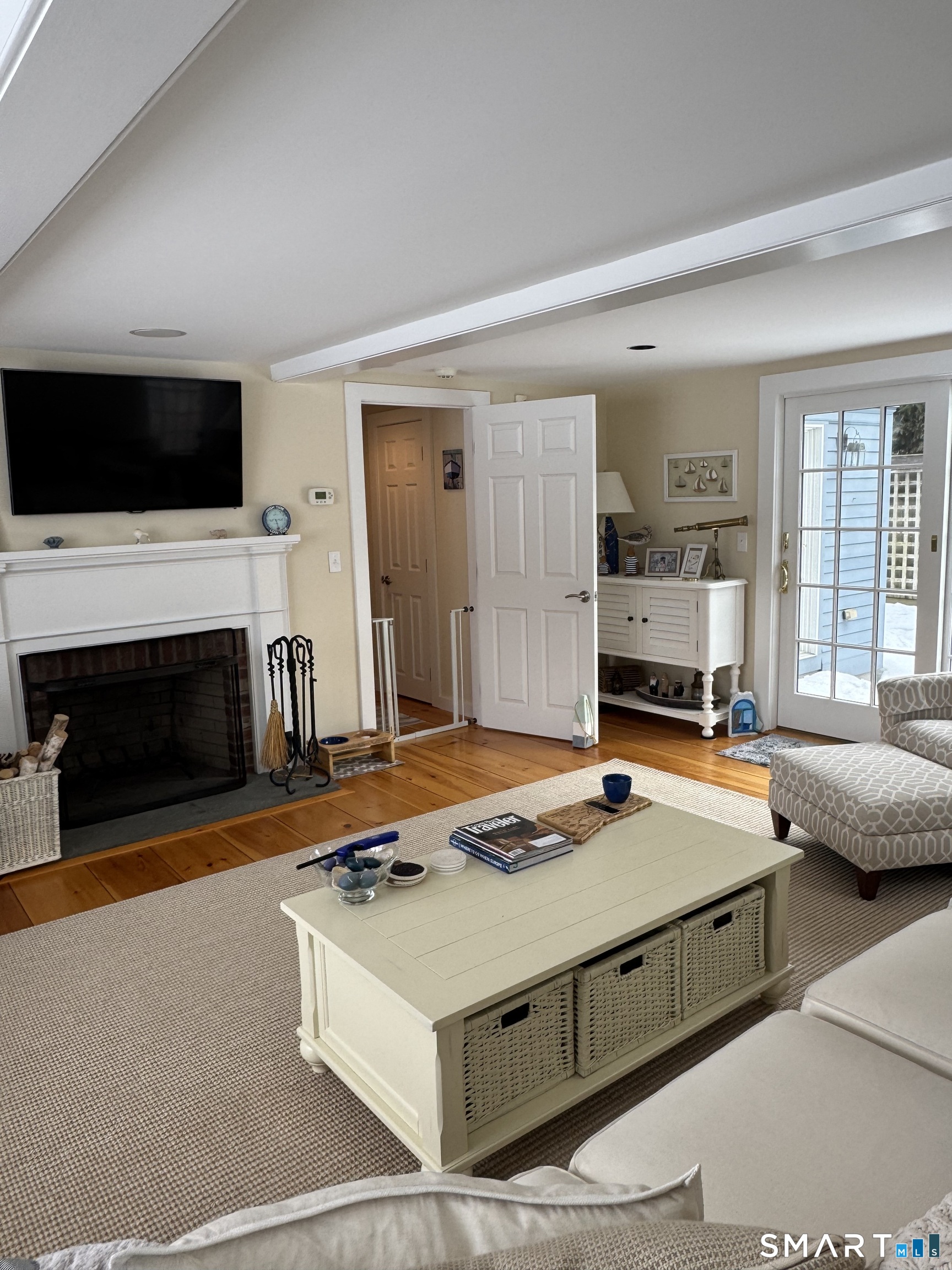 84 Waterside Lane, Unit 3 Clinton, CT 06413 - Photo 17 of 37 a bedroom with a bed and a flat screen tv