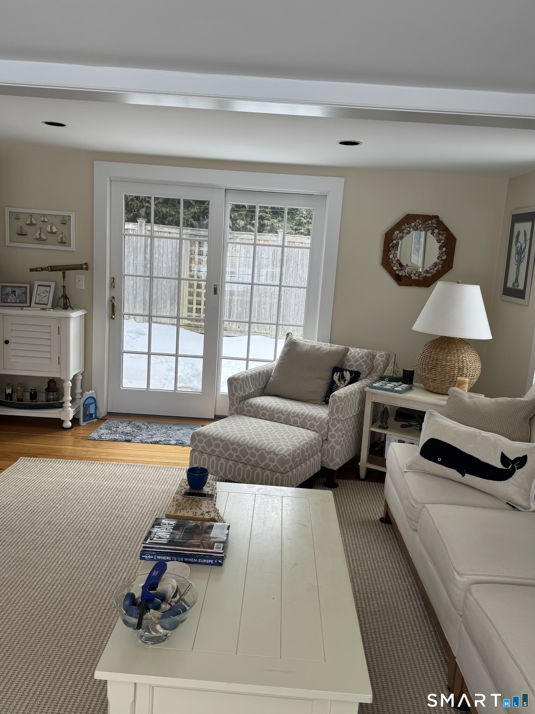84 Waterside Lane, Unit 3 Clinton, CT 06413 - Photo 18 of 37 a living room with furniture and a large window