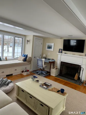 a kitchen with stainless steel appliances granite countertop a sink a stove and a wooden cabinets