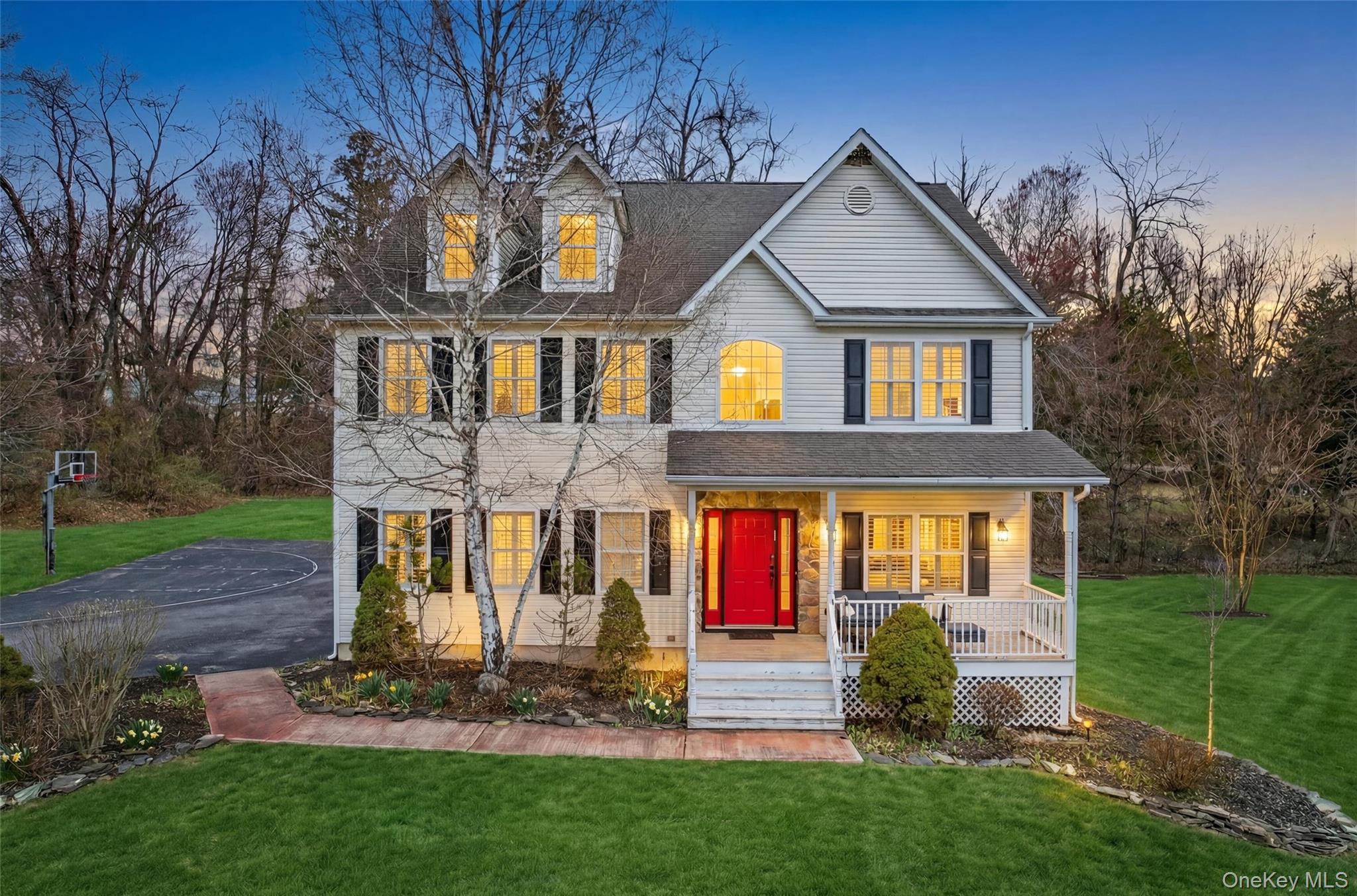 View of front of home featuring a lawn and covered porch