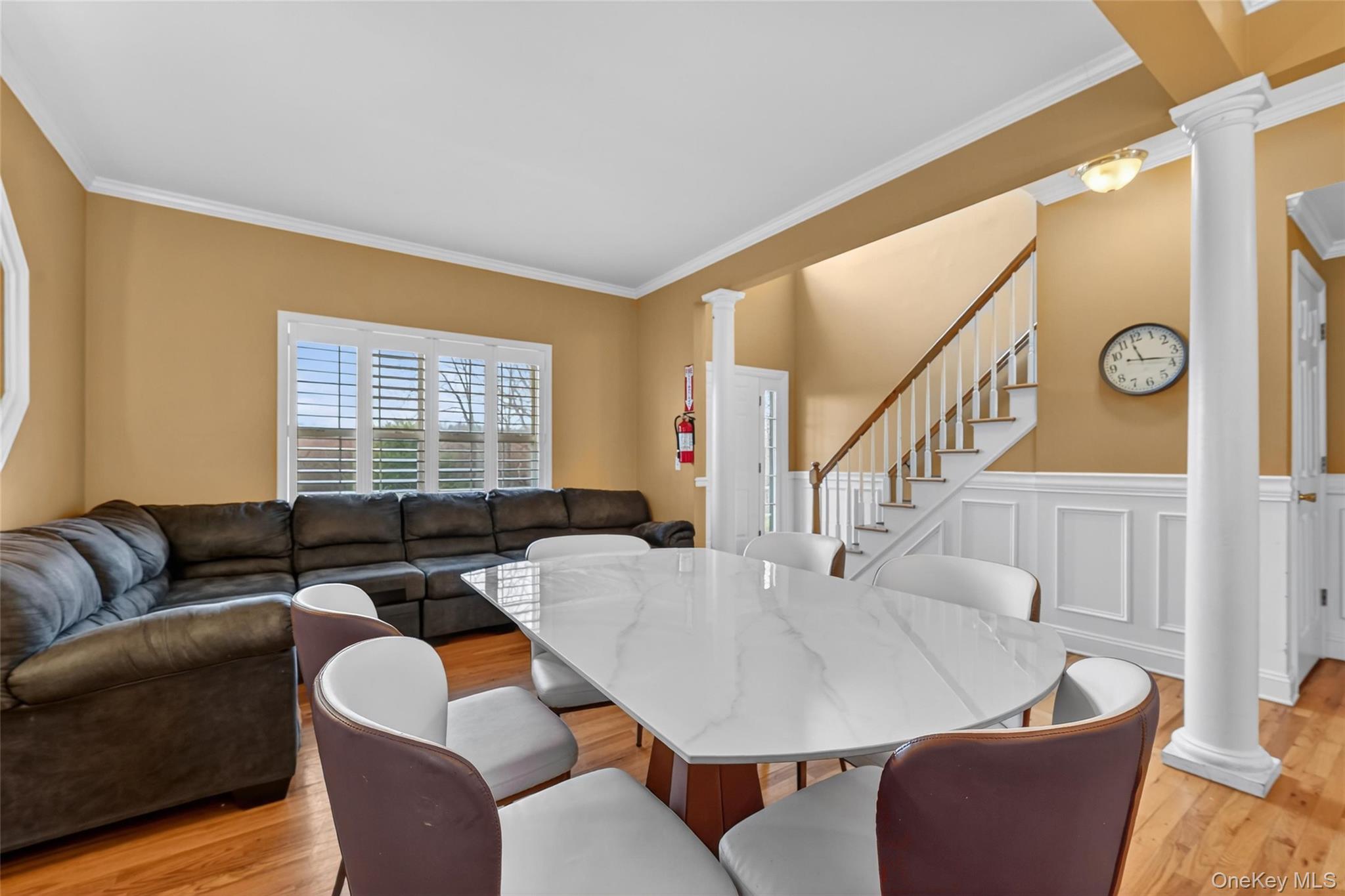 1071 Craigville Road Chester, NY 10918 - Photo 11 of 48 Dining room featuring decorative columns, ornamental molding, and light wood finished floors