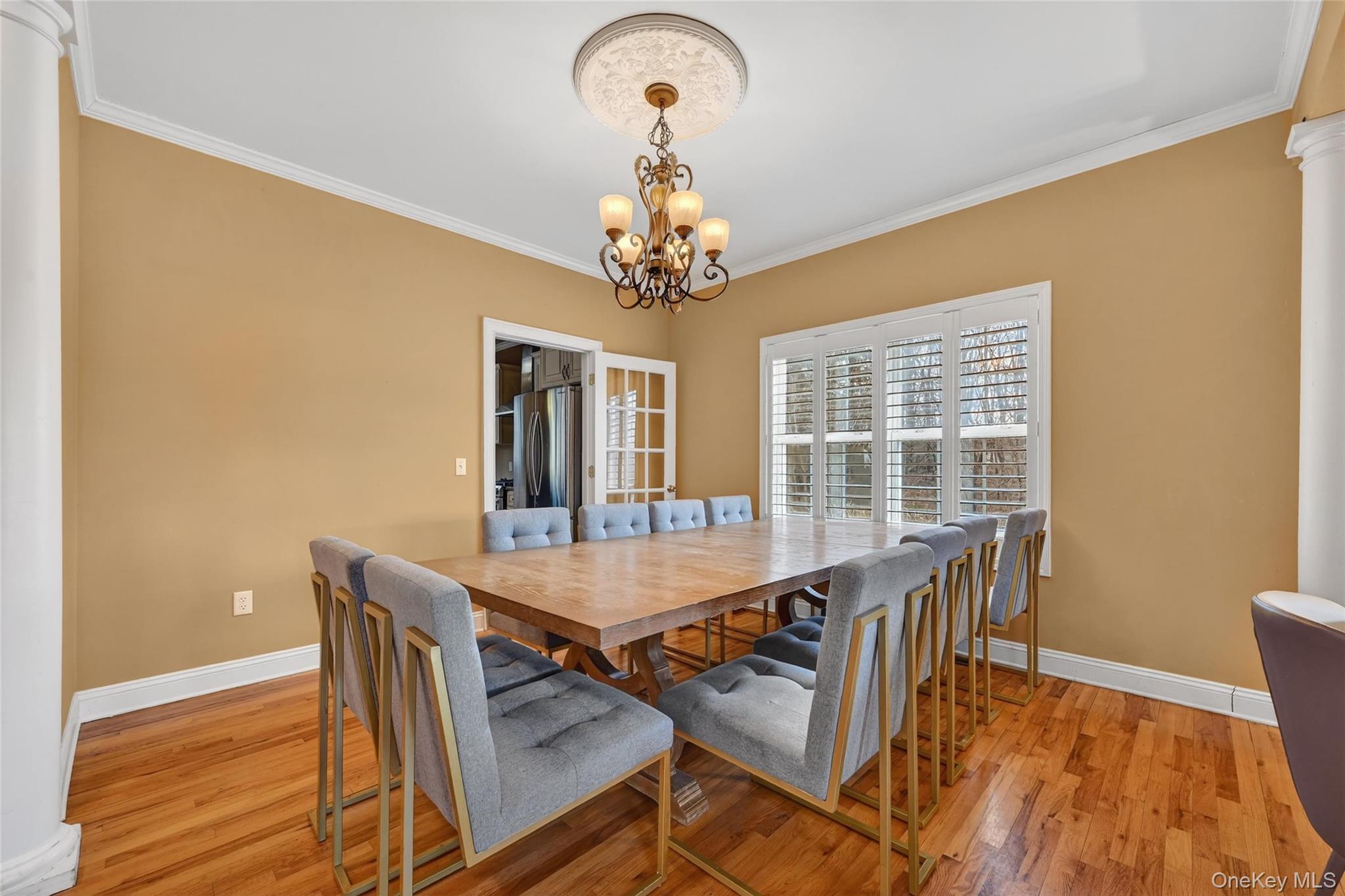 1071 Craigville Road Chester, NY 10918 - Photo 12 of 48 Dining space with crown molding, suspended lighting, light wood finished floors, and ornate columns