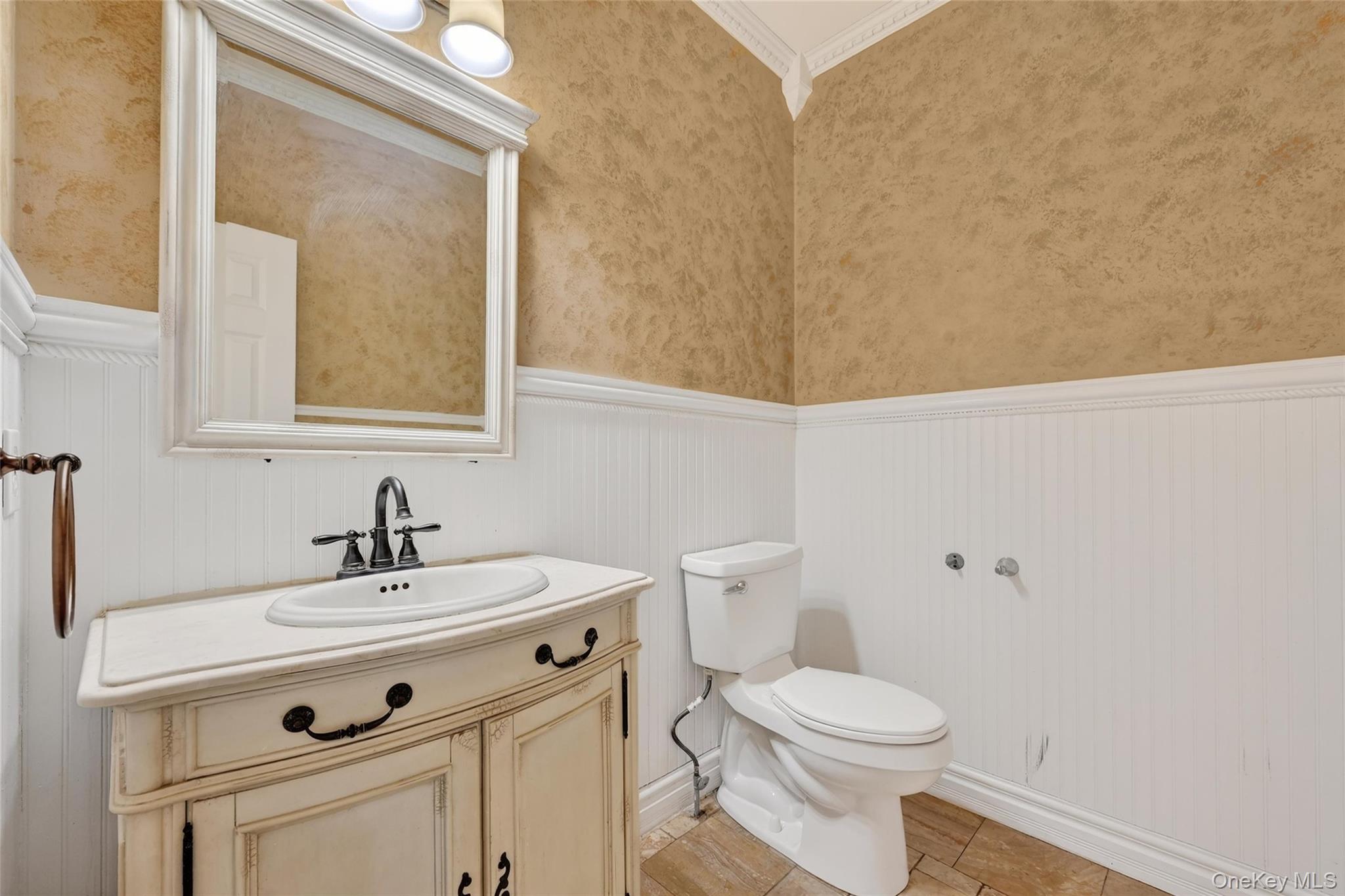 1071 Craigville Road Chester, NY 10918 - Photo 18 of 48 Half bathroom with vanity, a wainscoted wall, and crown molding