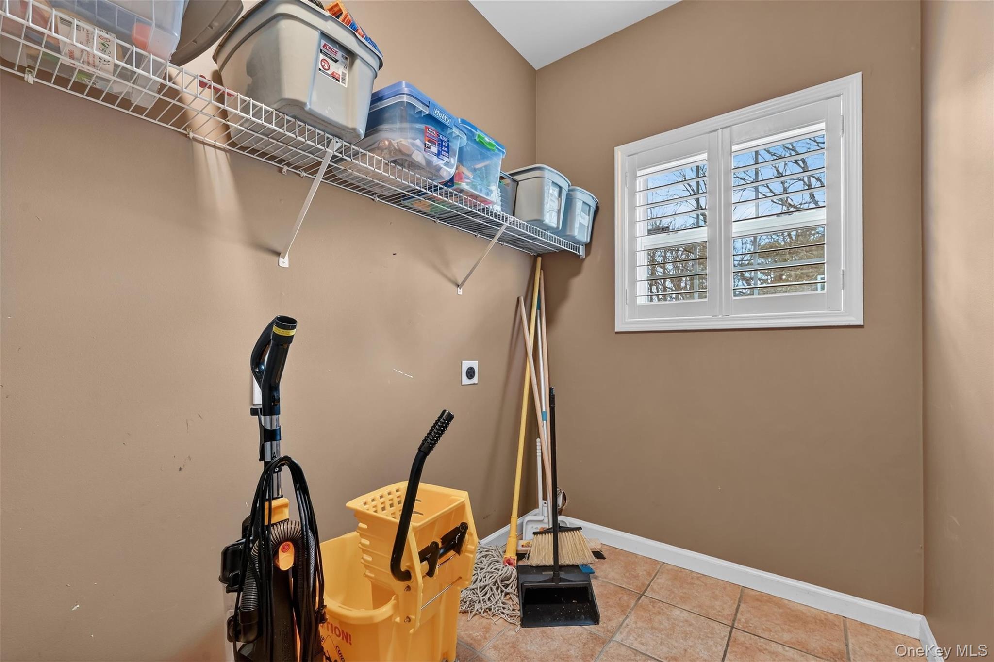 1071 Craigville Road Chester, NY 10918 - Photo 19 of 48 Laundry room featuring light tile patterned floors and electric dryer hookup