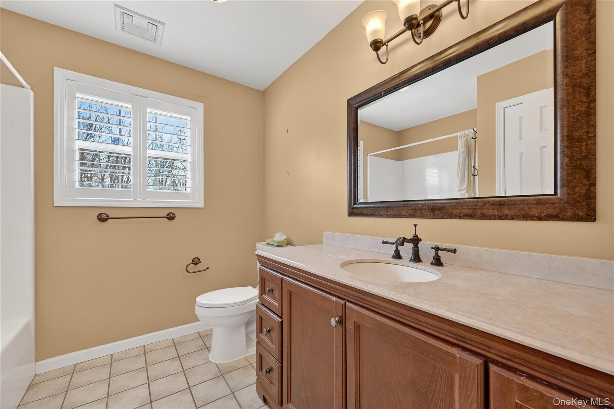 1071 Craigville Road Chester, NY 10918 - Photo 24 of 48 Full bathroom featuring vanity and light tile patterned flooring