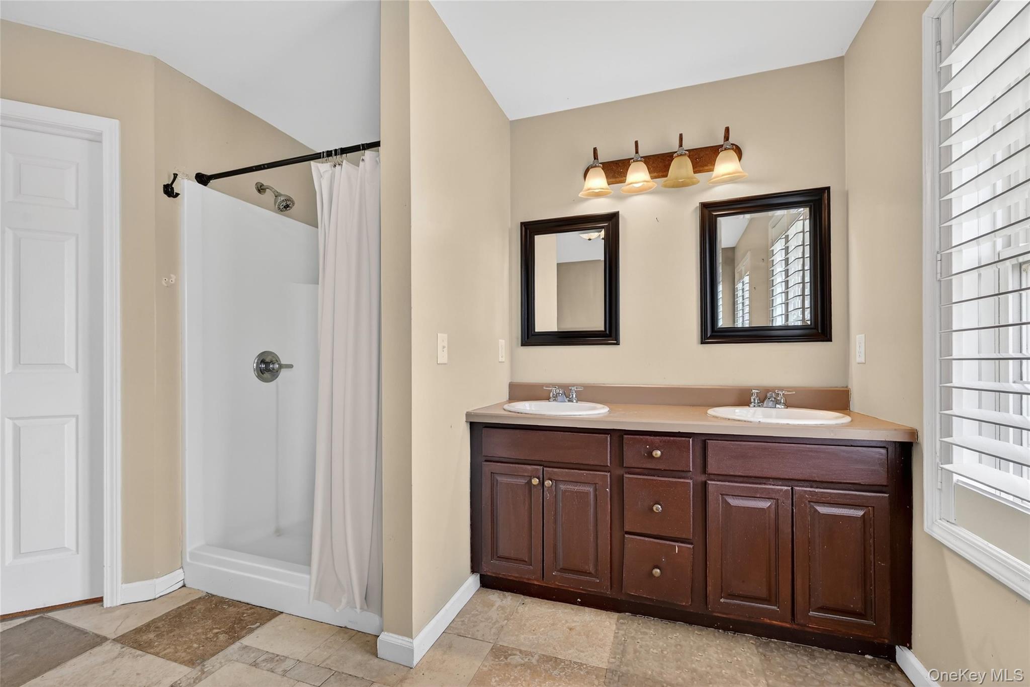 1071 Craigville Road Chester, NY 10918 - Photo 35 of 48 Bathroom with double vanity and a stall shower