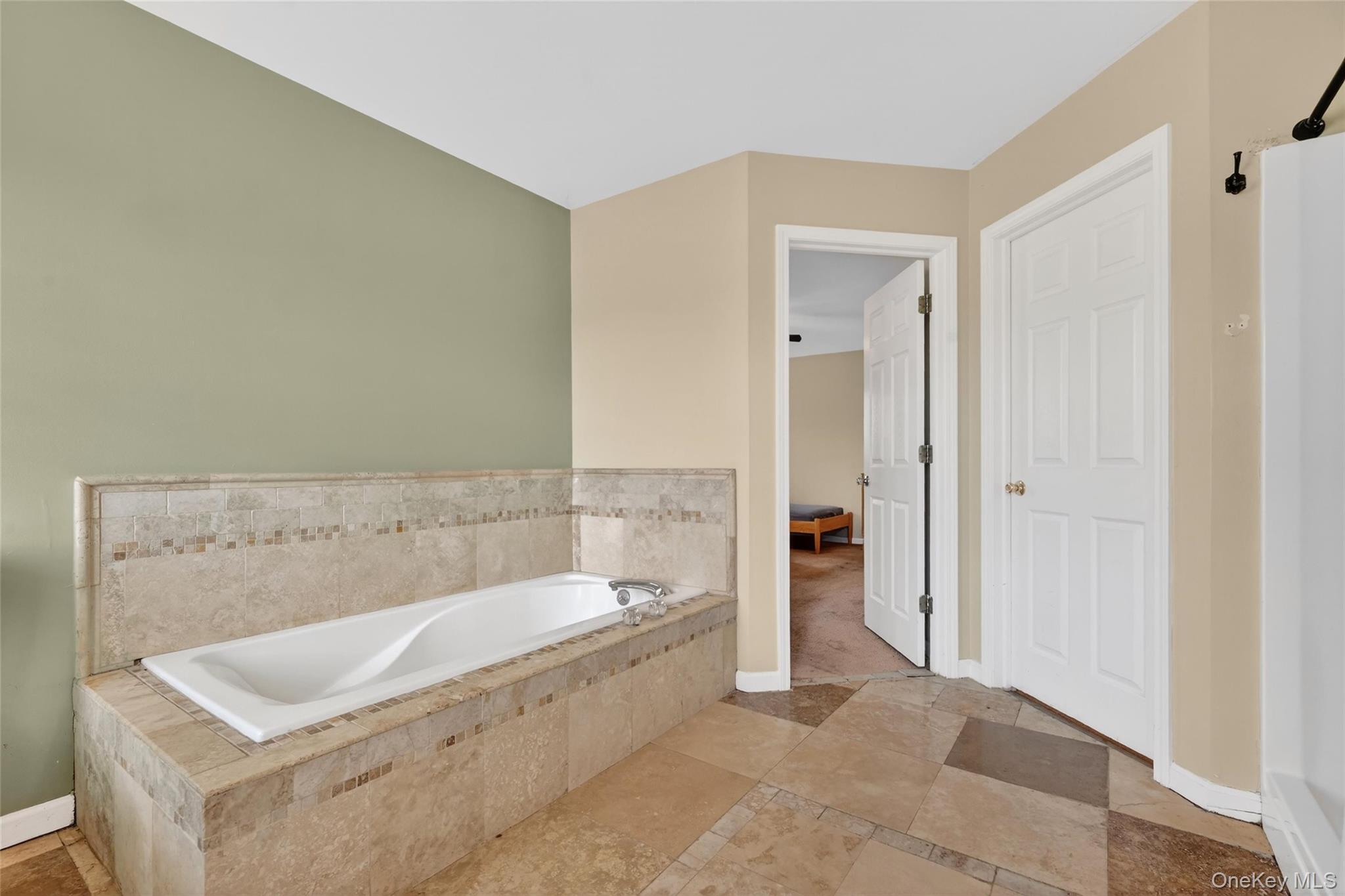 1071 Craigville Road Chester, NY 10918 - Photo 36 of 48 Bathroom featuring a bath and light tile-patterned floors