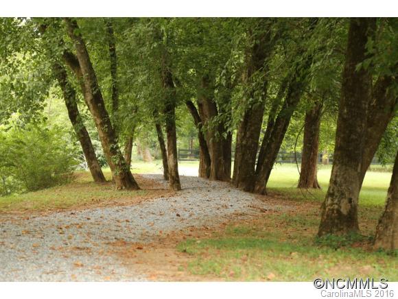 23 Rambling Creek Road, Unit 23 Tryon, NC 28782 - Photo 8 of 10 a view of backyard of trees
