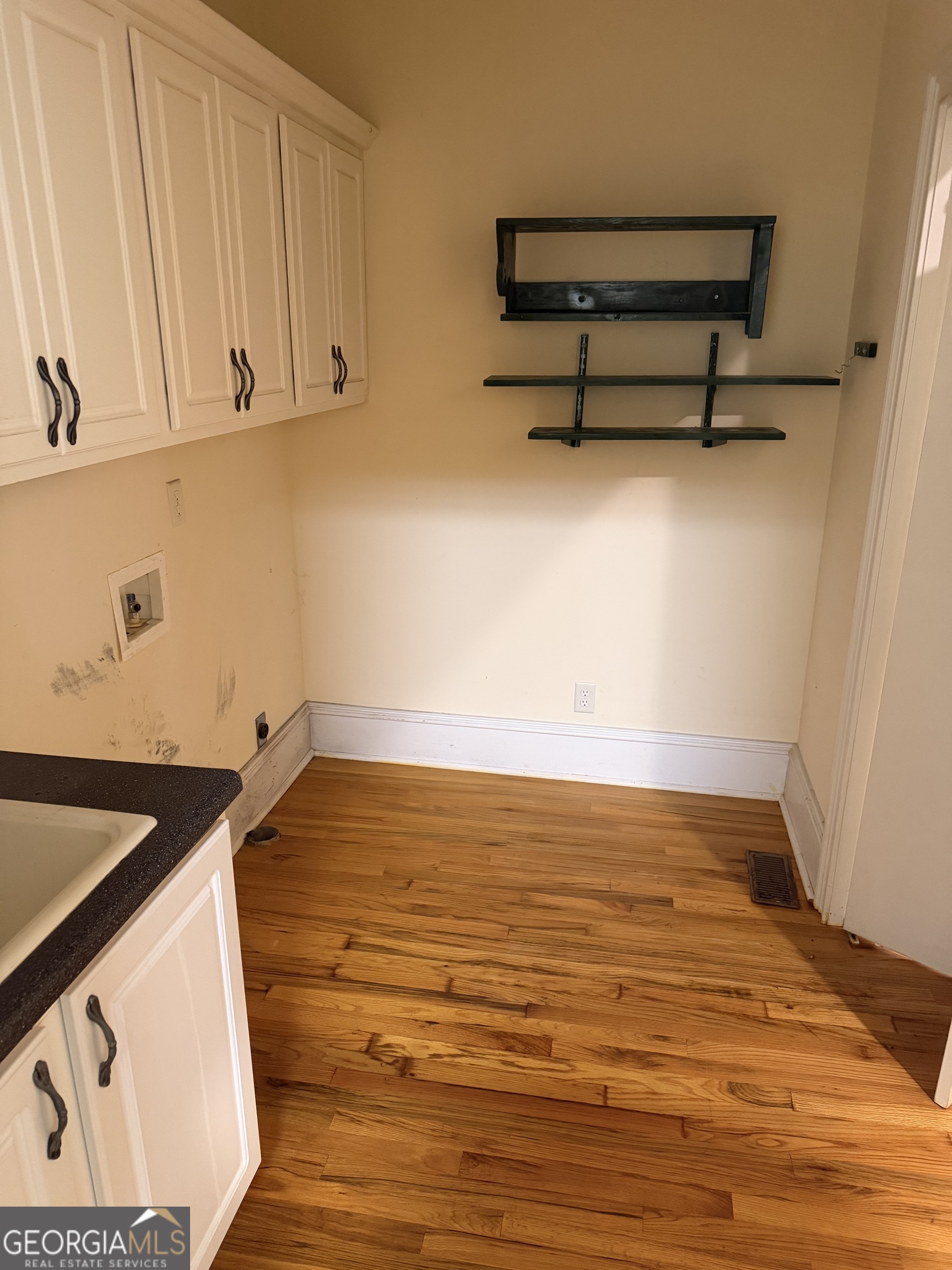 302 Norris Road Barnesville, GA 30204 - Photo 48 of 65 a view of a room with wooden floor and cabinet