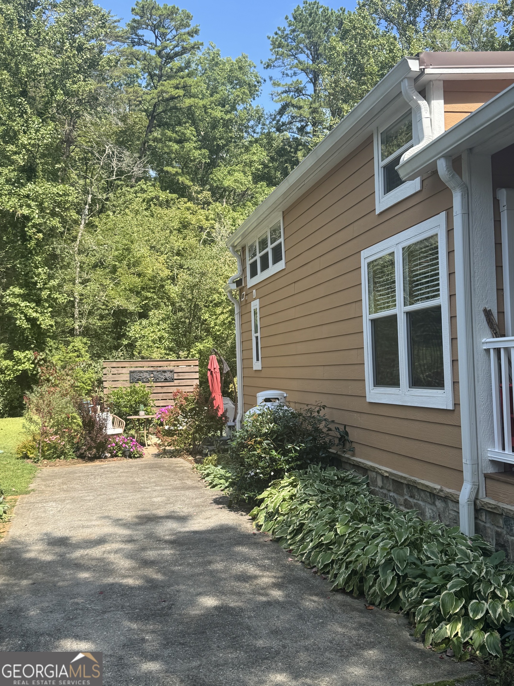 4960 Laurel Lodge Road Clarkesville, GA 30523 - Photo 15 of 19 a view of a house with a yard and potted plants