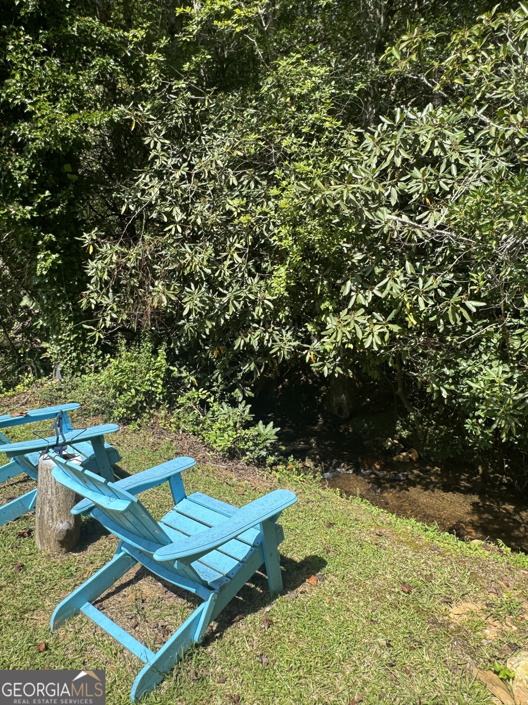 4960 Laurel Lodge Road Clarkesville, GA 30523 - Photo 16 of 19 a view of a backyard with chairs