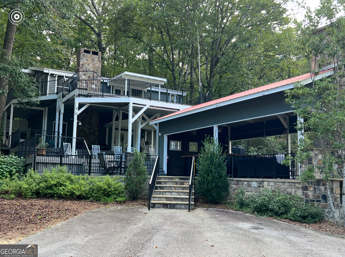 4960 Laurel Lodge Road Clarkesville, GA 30523 - Photo 20 of 21 a front view of a house with garden