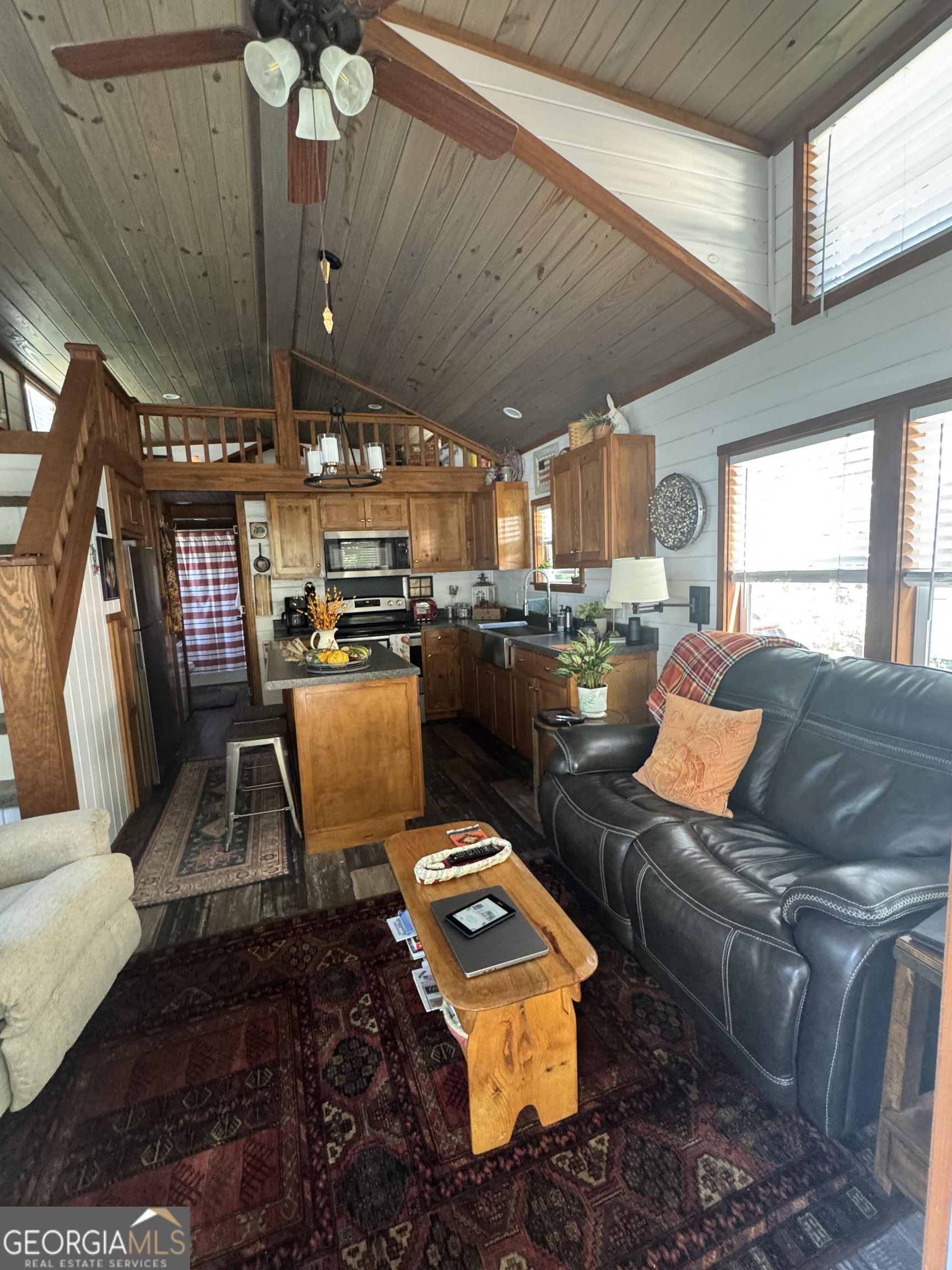 4960 Laurel Lodge Road Clarkesville, GA 30523 - Photo 7 of 21 a living room with lots of furniture and a chandelier