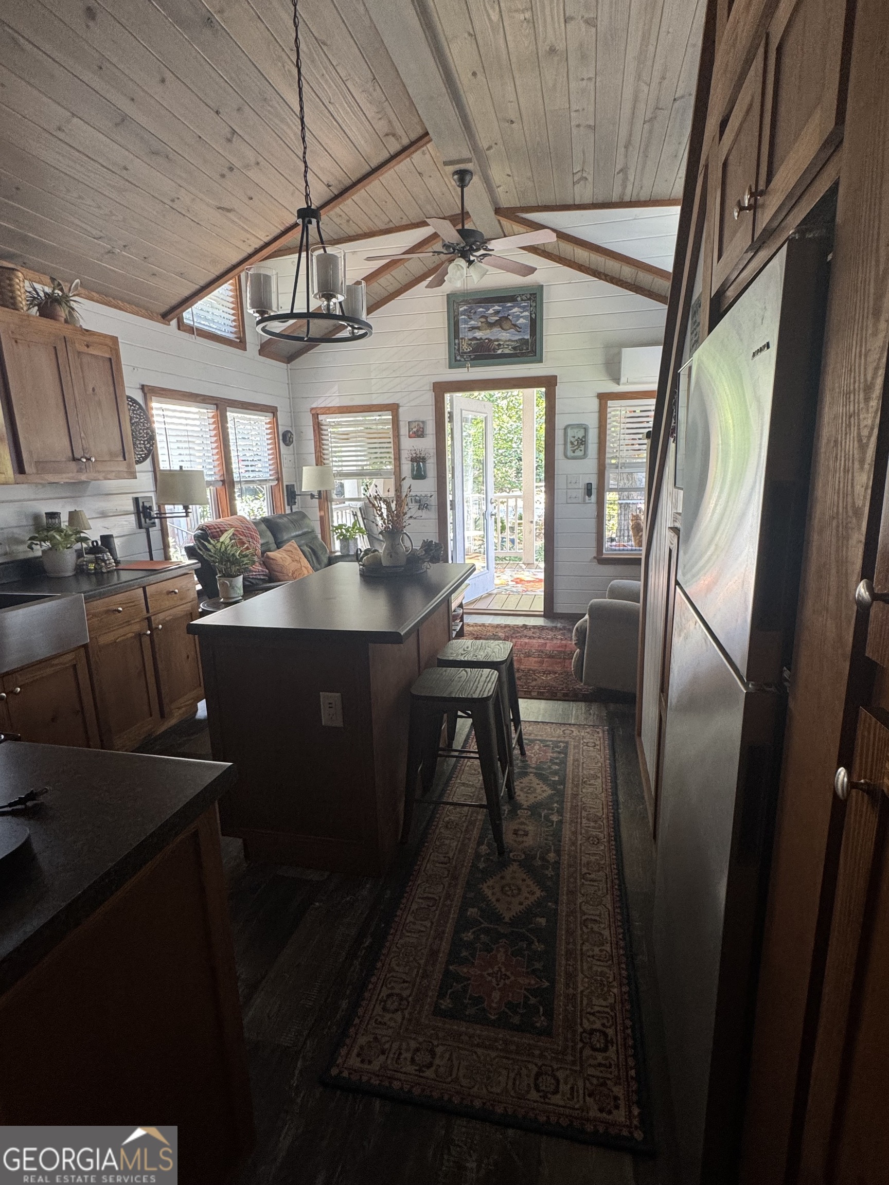 4960 Laurel Lodge Road Clarkesville, GA 30523 - Photo 8 of 19 a kitchen with sink a window and chairs