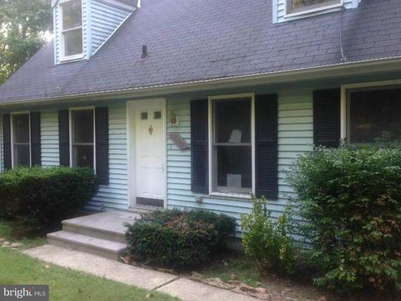3772 Roop Road New Windsor, MD 21776 - Photo 1 of 10 a front view of a brick building with potted plants