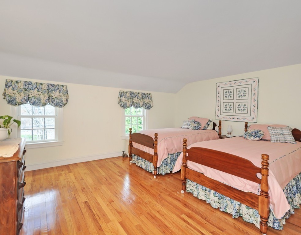 51 Harvard Road Stow, MA 01775 - Photo 11 of 17 a bedroom with two beds and a dresser with wooden floor