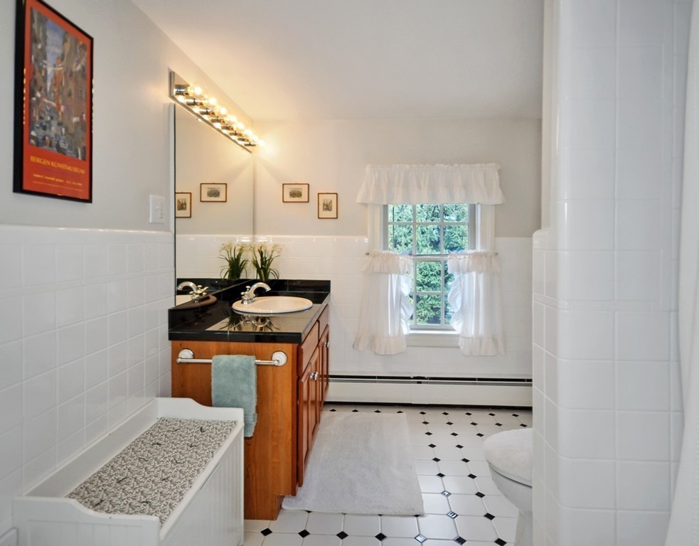 51 Harvard Road Stow, MA 01775 - Photo 13 of 17 a bathroom with a granite countertop sink a window and a mirror