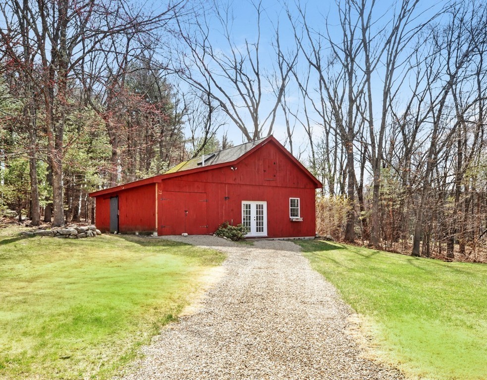 51 Harvard Road Stow, MA 01775 - Photo 3 of 17 a view of a house with a yard