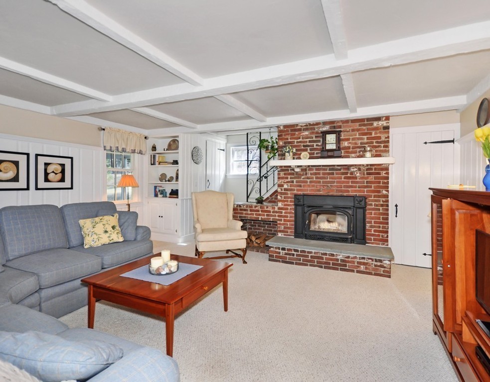 51 Harvard Road Stow, MA 01775 - Photo 7 of 17 a living room with furniture and a fireplace
