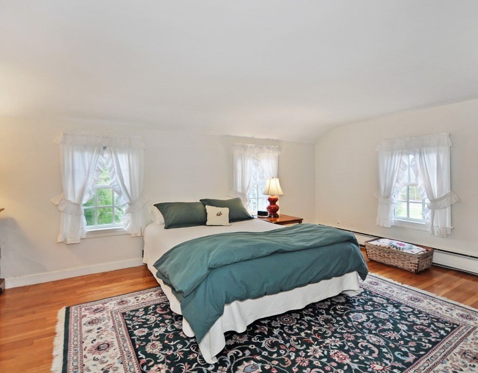 51 Harvard Road Stow, MA 01775 - Photo 10 of 17 a bedroom with a bed and a window