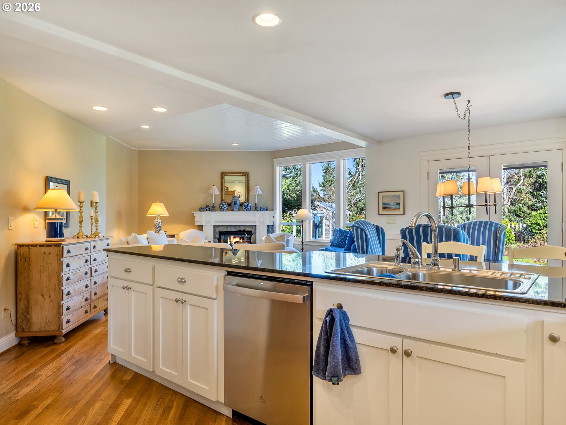 2537 Pine Ridge Drive Gearhart, OR 97138 - Photo 17 of 35 a kitchen with white cabinets and sink