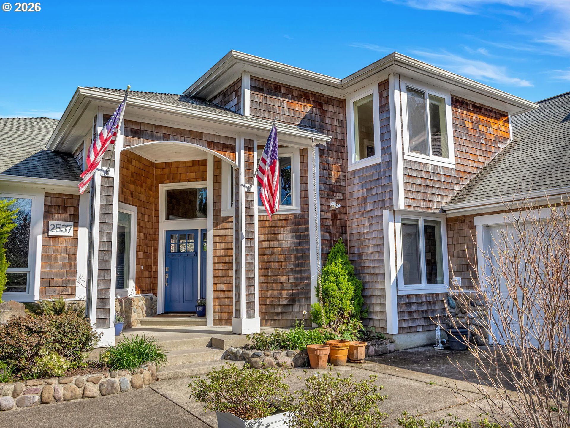 2537 Pine Ridge Drive Gearhart, OR 97138 - Photo 2 of 35 a front view of a house with a yard