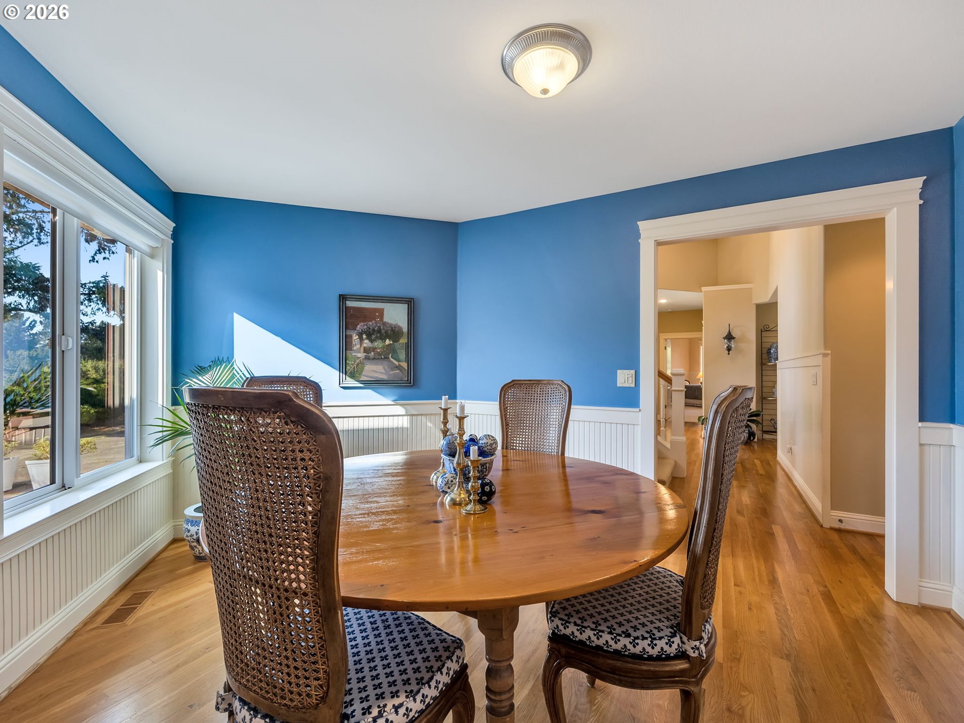 2537 Pine Ridge Drive Gearhart, OR 97138 - Photo 22 of 35 a dining room with furniture a window and wooden floor