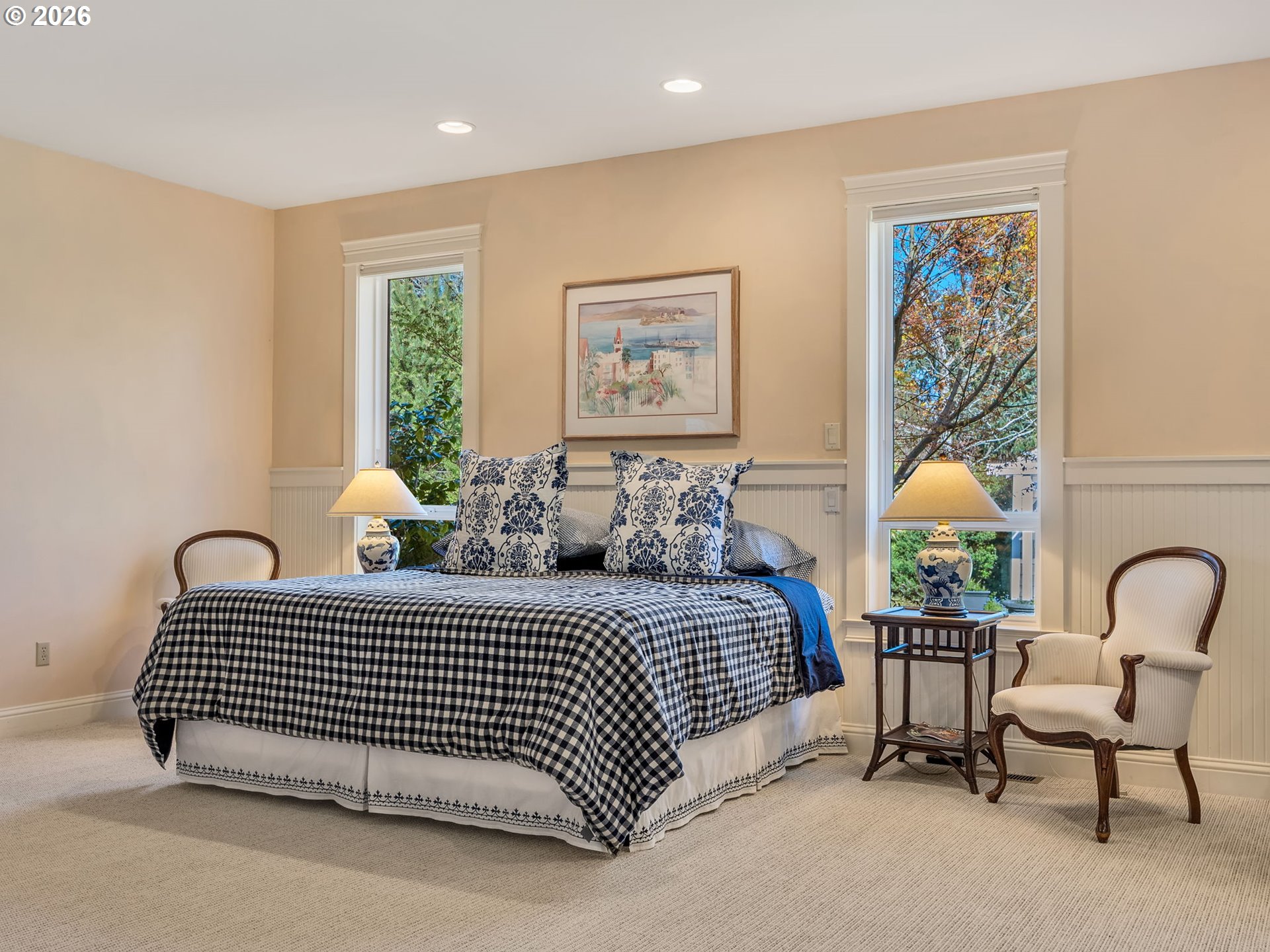 2537 Pine Ridge Drive Gearhart, OR 97138 - Photo 26 of 35 a bedroom with a bed and glass windows