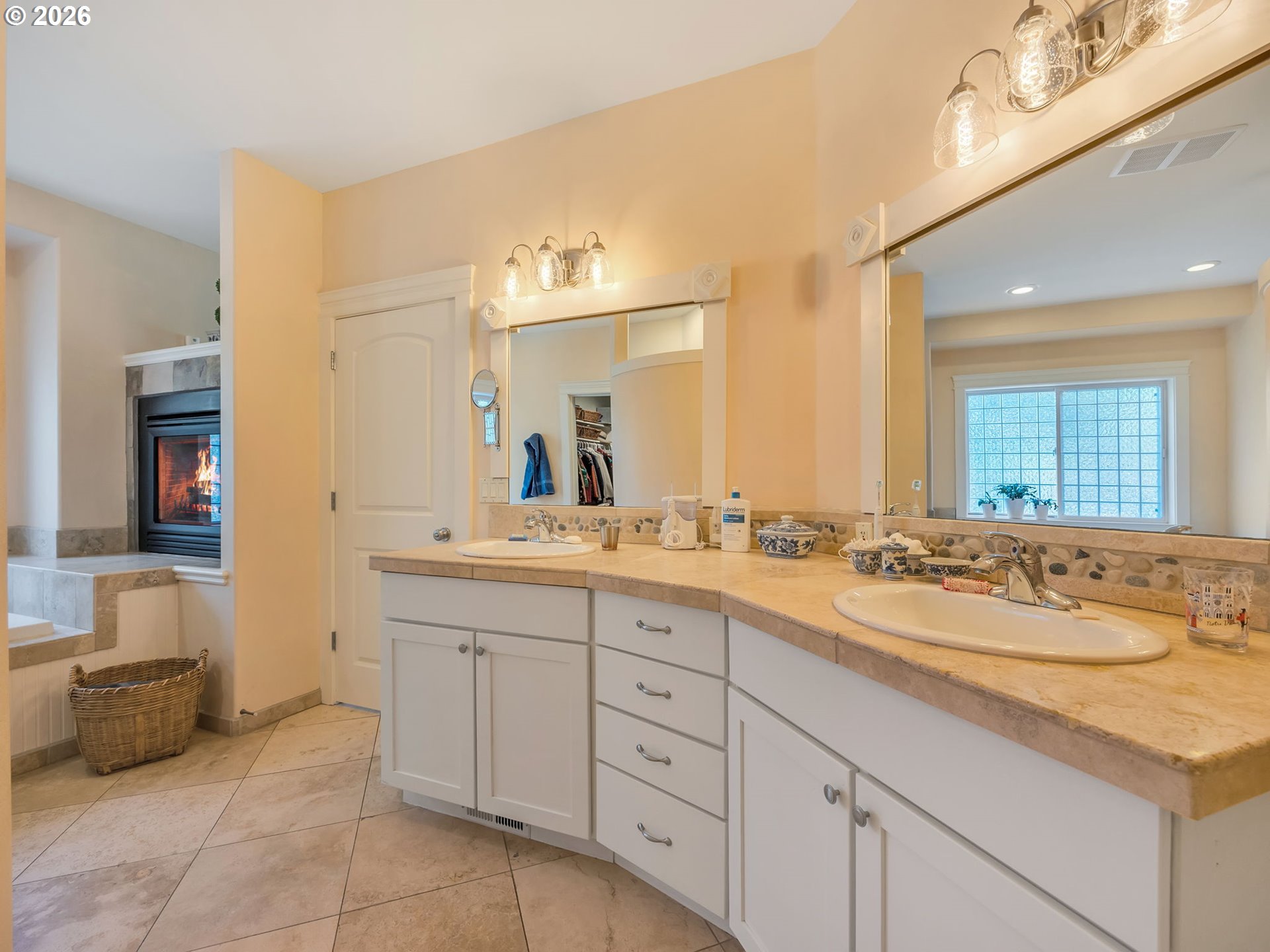 2537 Pine Ridge Drive Gearhart, OR 97138 - Photo 30 of 35 a spacious bathroom with a double vanity sink and a mirror