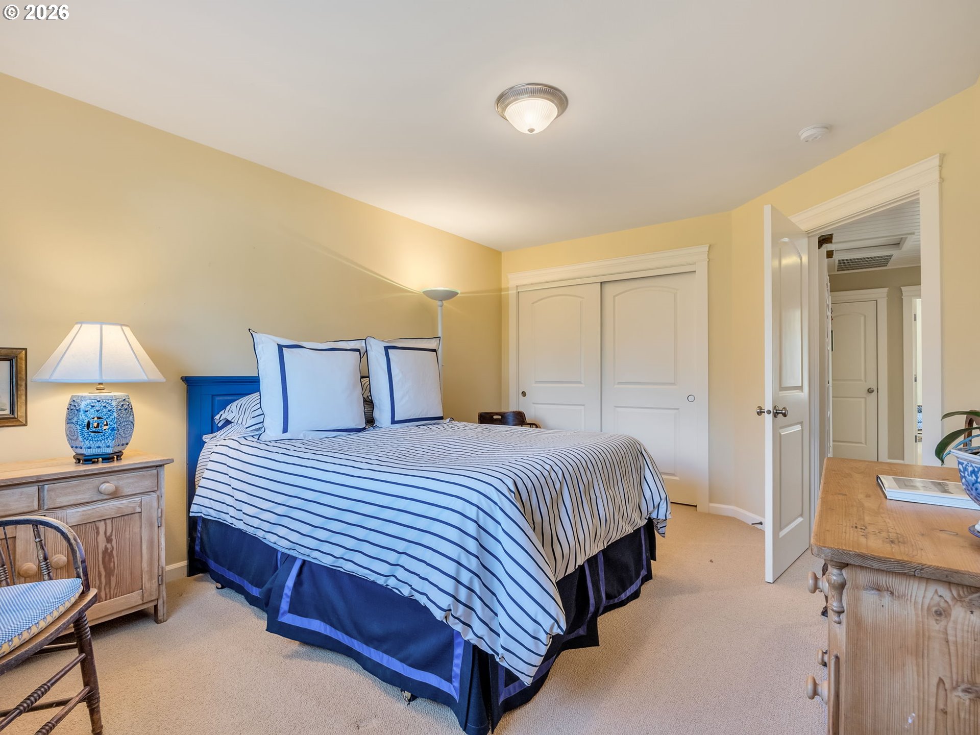 2537 Pine Ridge Drive Gearhart, OR 97138 - Photo 35 of 35 a bedroom with a bed and a lamp