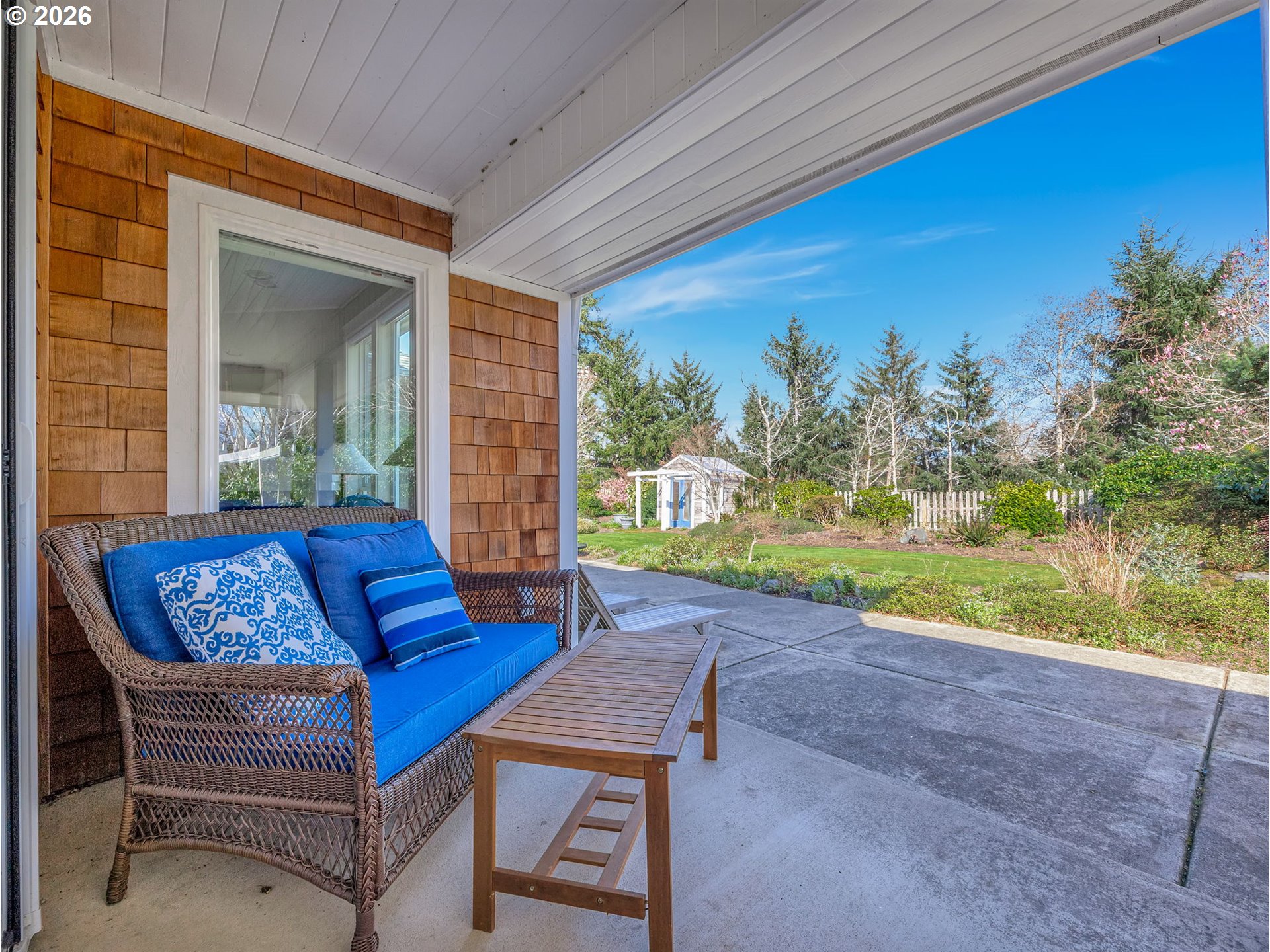 2537 Pine Ridge Drive Gearhart, OR 97138 - Photo 6 of 35 a blue bench sitting in front of a building