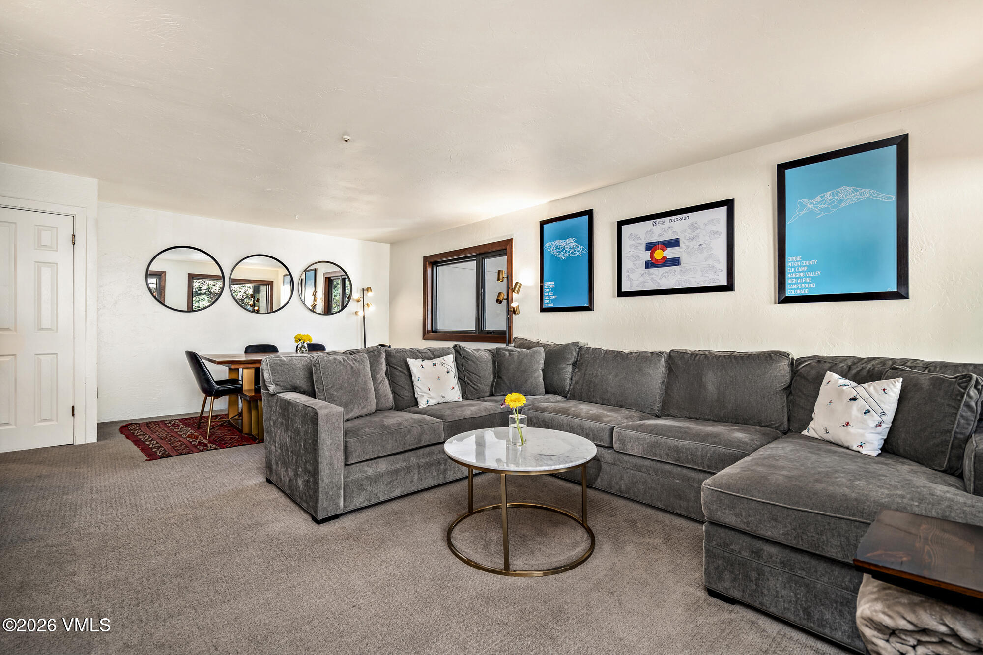963 Lions Ridge Loop, Unit 502 Vail, CO 81657 - Photo 3 of 30 a living room with furniture and a table