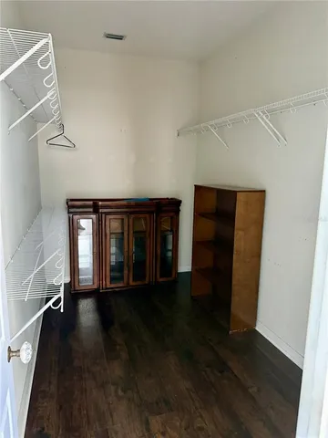 a bathroom with a granite countertop sink a toilet and shower