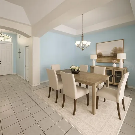 a dining room with furniture and window