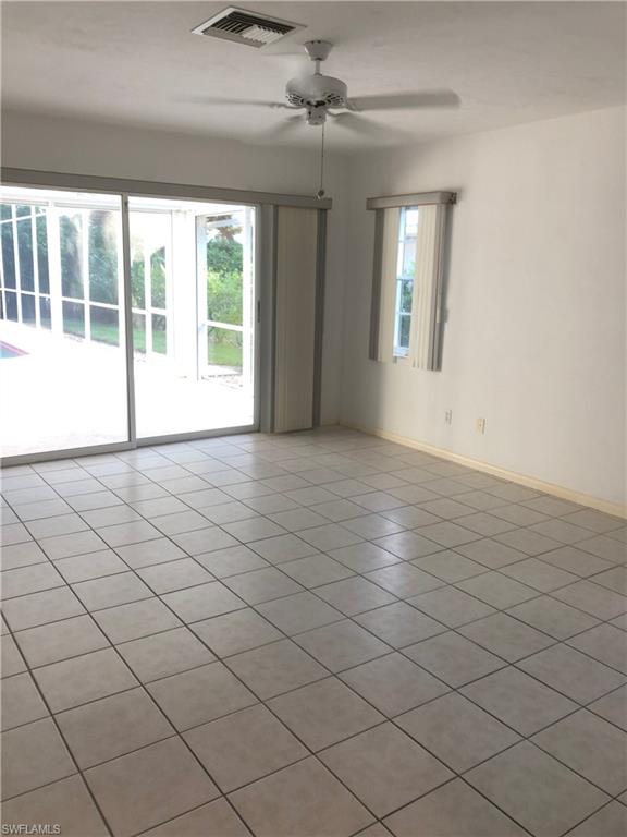 538 Roma Court Naples, FL 34110 - Photo 13 of 19 a view of an empty room with a window