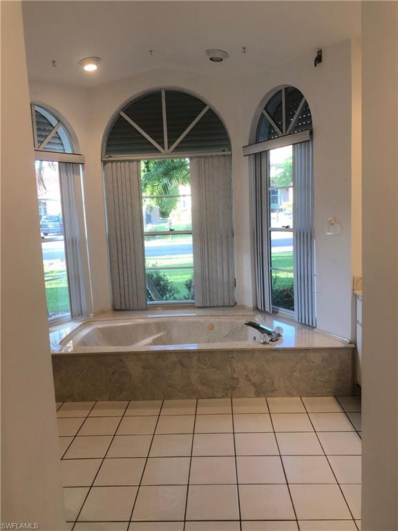 538 Roma Court Naples, FL 34110 - Photo 14 of 19 a view of entryway and hall with a window