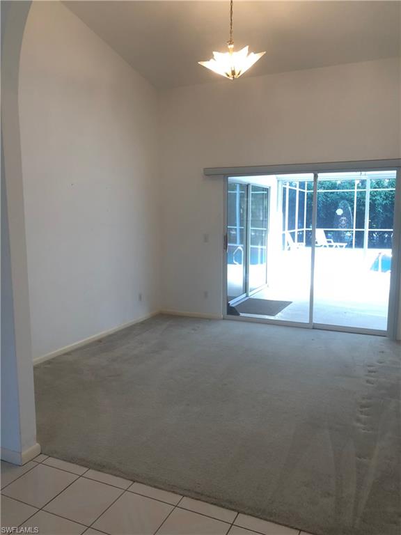 538 Roma Court Naples, FL 34110 - Photo 15 of 19 a view of an empty room with a window